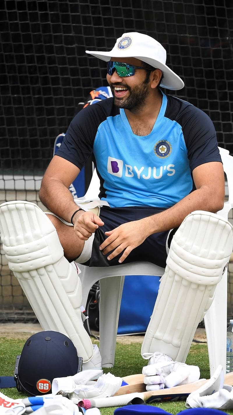 Rohit Sharma With Cricket Batting Pads, rohit sharma, cricket, batting, pads, cricketer, sitting, laughing, HD phone wallpaper