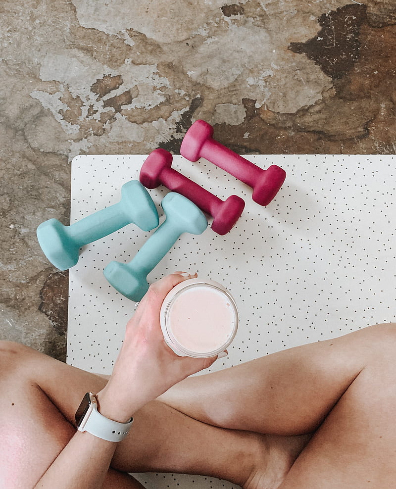 person holding white liquid filled cup above two pairs of dumbbells, HD phone wallpaper