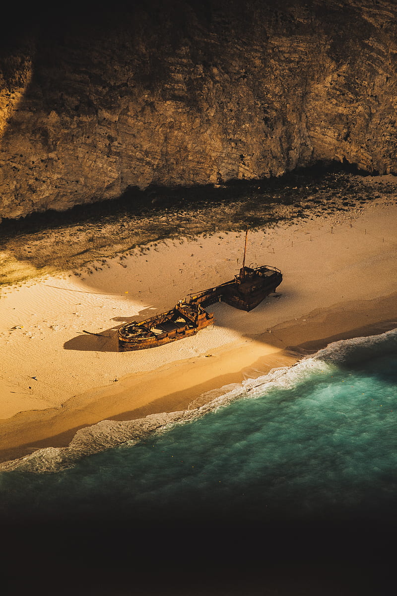wrecked and abandoned ship on shore of an island during golden hour, HD phone wallpaper