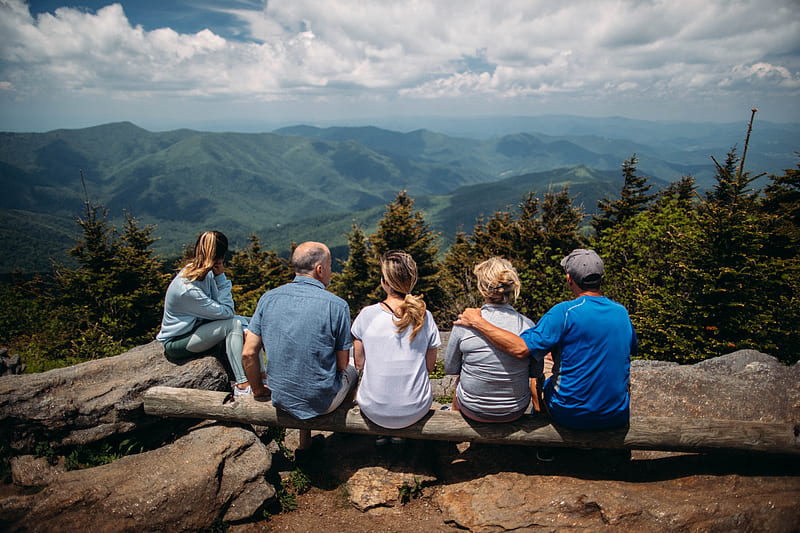 group of people sitting on rocks overlooking mountain, HD wallpaper