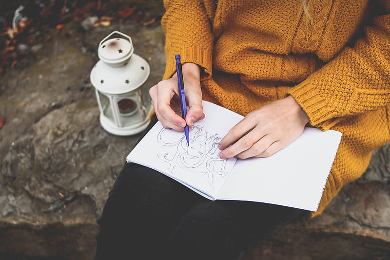 person drawing on sketch book near white lantern, HD wallpaper