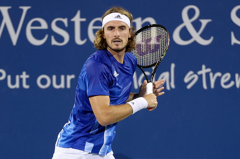 Download Stefanos Tsitsipas With Arms Stretched Wallpaper | Wallpapers.com