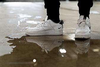 Person in black pants and white nike air force 1 high photo – Free