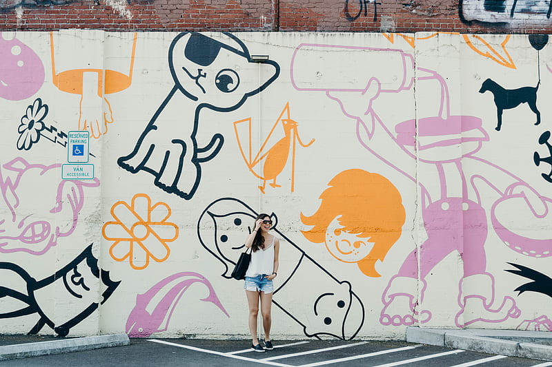 candid graphy of woman standing against graffiti wall with broad smile, HD wallpaper