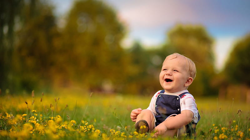Smiley Cute Boy Is Sitting On Grass Wearing Blue White Dress In Blur Bokeh Background Cute, HD wallpaper