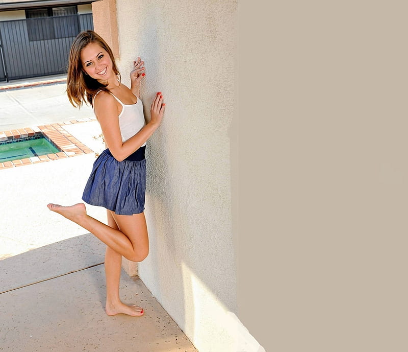Riley Reid in the breeze way, blue mini skirt, spaghetti straps, brunette, painted finger and toe nails, white top, black waist band, hands on the wall, HD wallpaper
