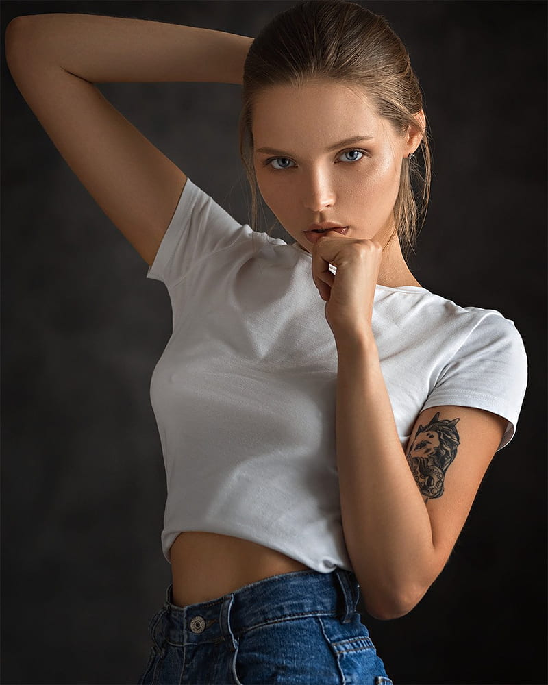 Evgeny Sibiraev, women, model, gray eyes, arms behind head, jeans, white tops, finger on lips, inked girls, blue pants, looking at viewer, HD phone wallpaper