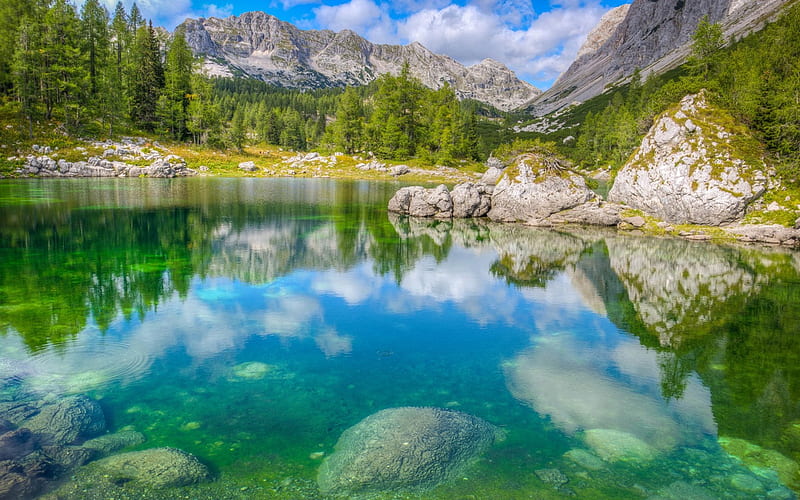 Alpine lake, rock, clouds, stones, peak, beauty, forests, mountainscape, ock, alps, sky, trees, pines, panorama, alpes, cool, mountains, awesome, white, landscape, scenic, bonito, trunks, cold, graphy, leaves, green, moss, mirror, scenery, beije, blue, amazing, reflex, lakescape, nic e, lake, leaf, apine, nature, branches, reflections, natural, scene, HD wallpaper