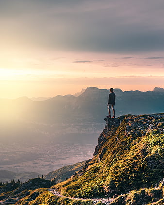 person standing alone on mountain