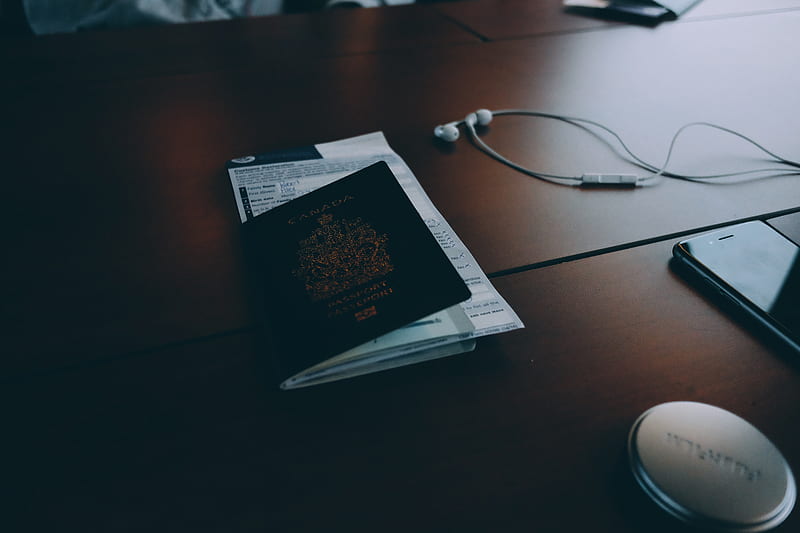 passport beside earphones on surface, HD wallpaper