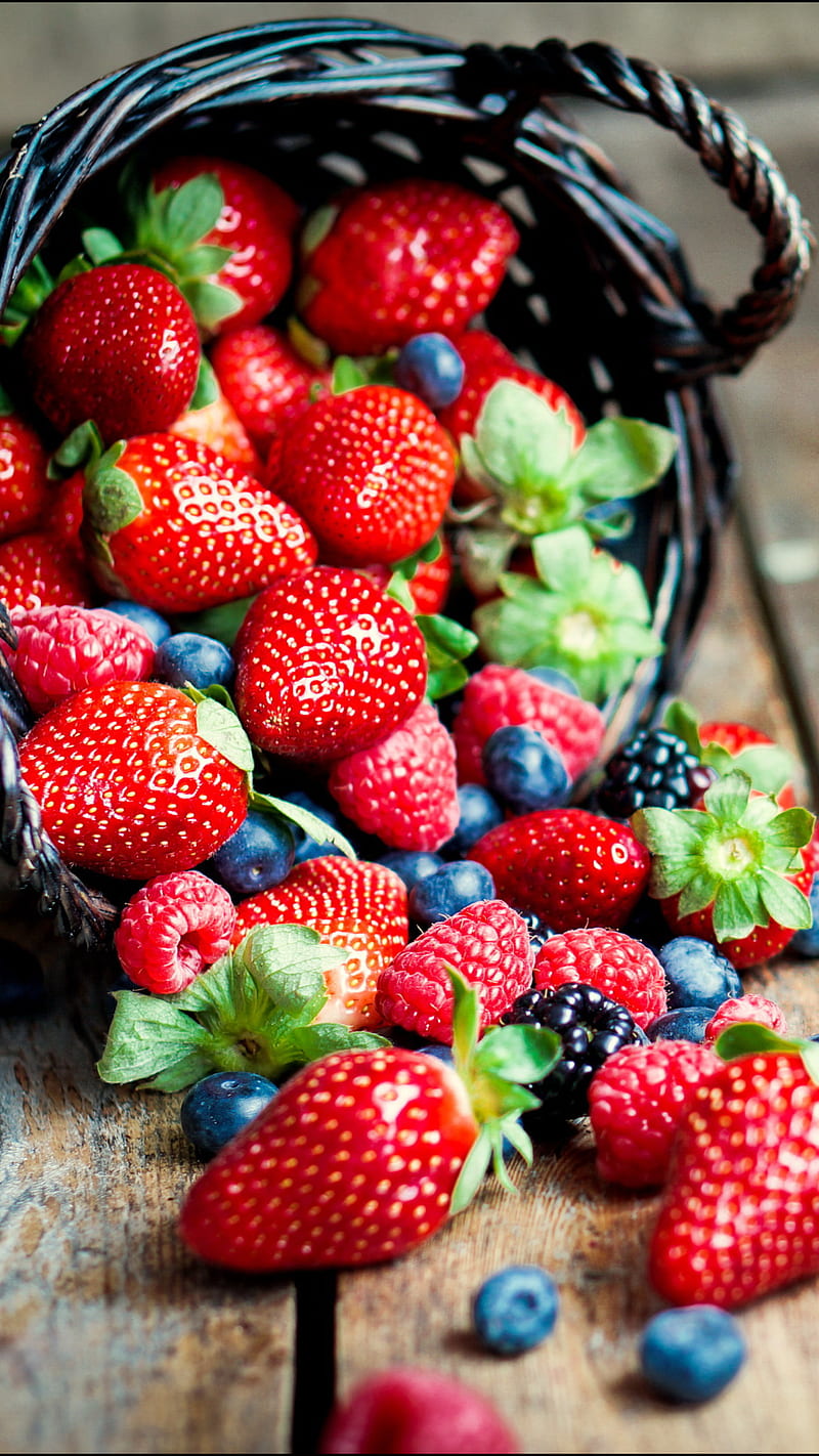 Premium AI Image  A wallpaper with a strawberry and berries on it