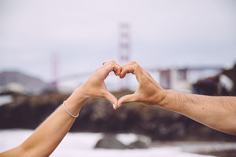 couple forming heart using their hands in focus graphy, HD wallpaper