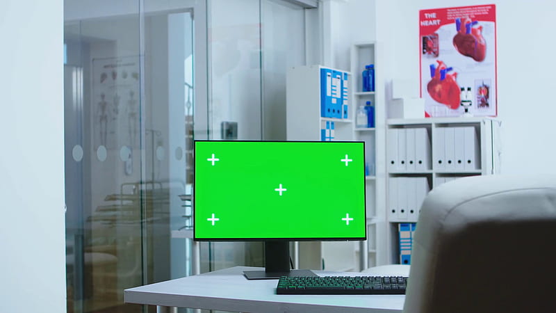 Computer with blank display in hospital cabinet and clinic personnel in the background. with copy space green screen mock up isolated available on medicine specialist in clinic cabinet. Stock Video Footage, HD wallpaper