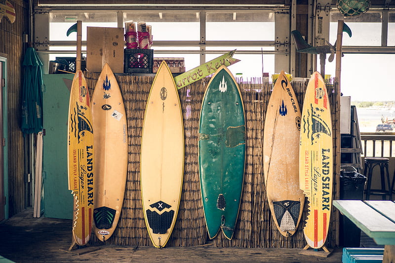 six assorted-color surfboards on brown board, HD wallpaper