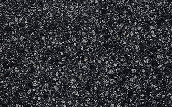 The texture of the background of stone black gray asphalt road