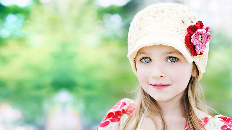 Cute Little Girl Is Wearing Yellow And Red Dress And Wool Knitted Cap On Head Standing In Blur Background Cute, HD wallpaper