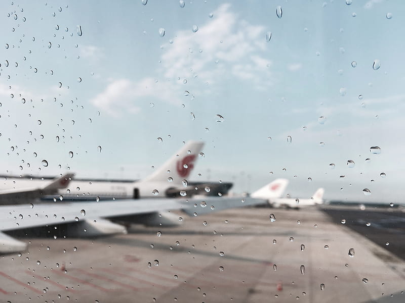 Planes at an airport, taken with a rain covered camera., HD wallpaper