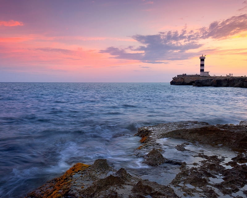 Lighthouse at Sunset, stone, nature, sunset, clouds, lighthouse, sea, landscape, HD wallpaper