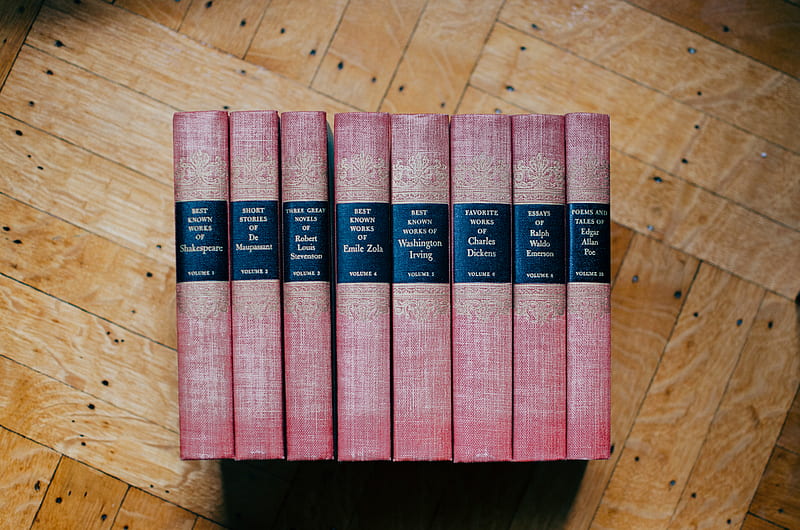 pile of red hardbound books on brown panel, HD wallpaper