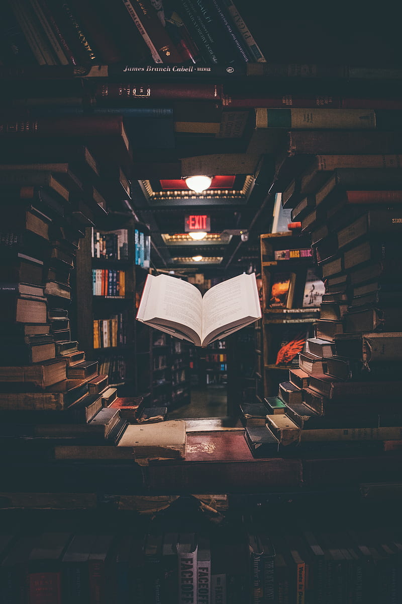 view of floating open book from stacked books in library, HD phone wallpaper