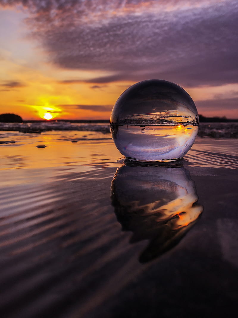 Photographer Captures Picture of Stunning 'Ice Ball' Phenomenon on Finnish  Beach