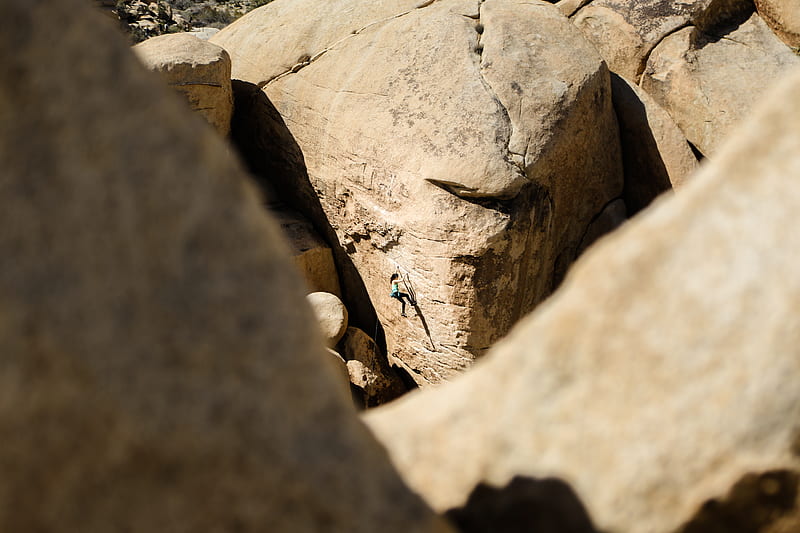 woman climbing on brown rock at daytime, HD wallpaper