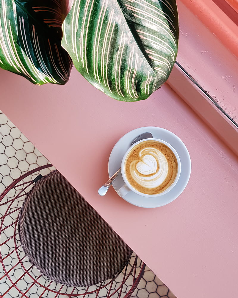 cup of coffee on saucer with teaspoon on pink tabletop, HD phone wallpaper