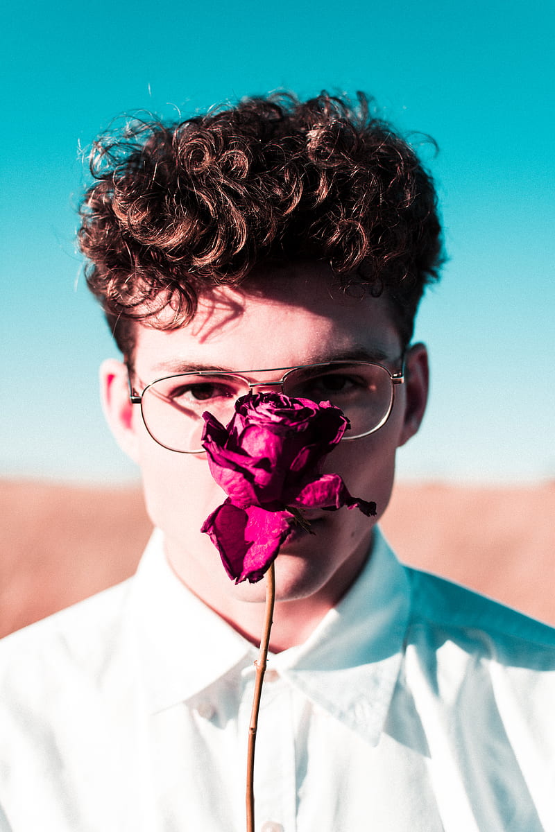 man with rose in front of face, HD phone wallpaper