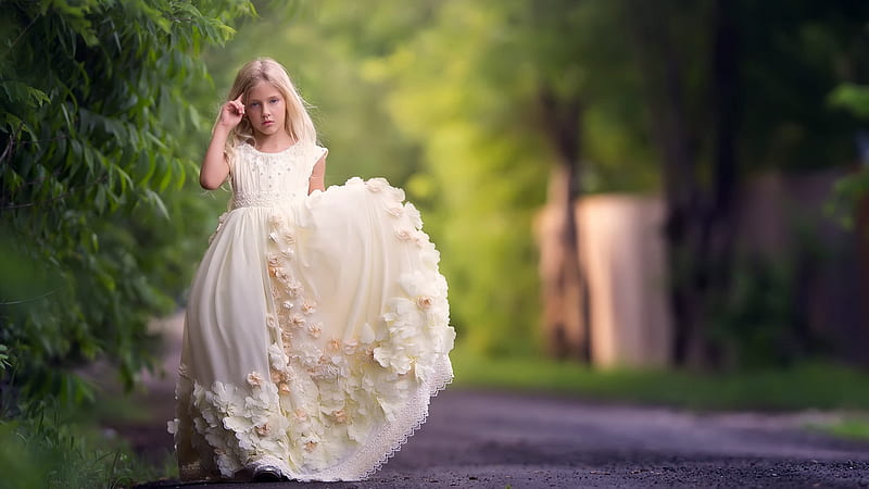 Cute Little Girl Is Wearing Light Sandal Color Dress Standing On Road In  Blur Green Background Cute, HD wallpaper | Peakpx