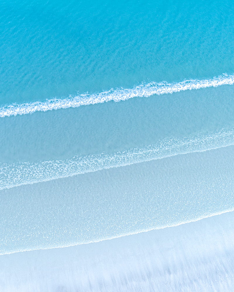 Aerial view of bright blue sea with foamy waves near sandy beach in daylight, HD phone wallpaper