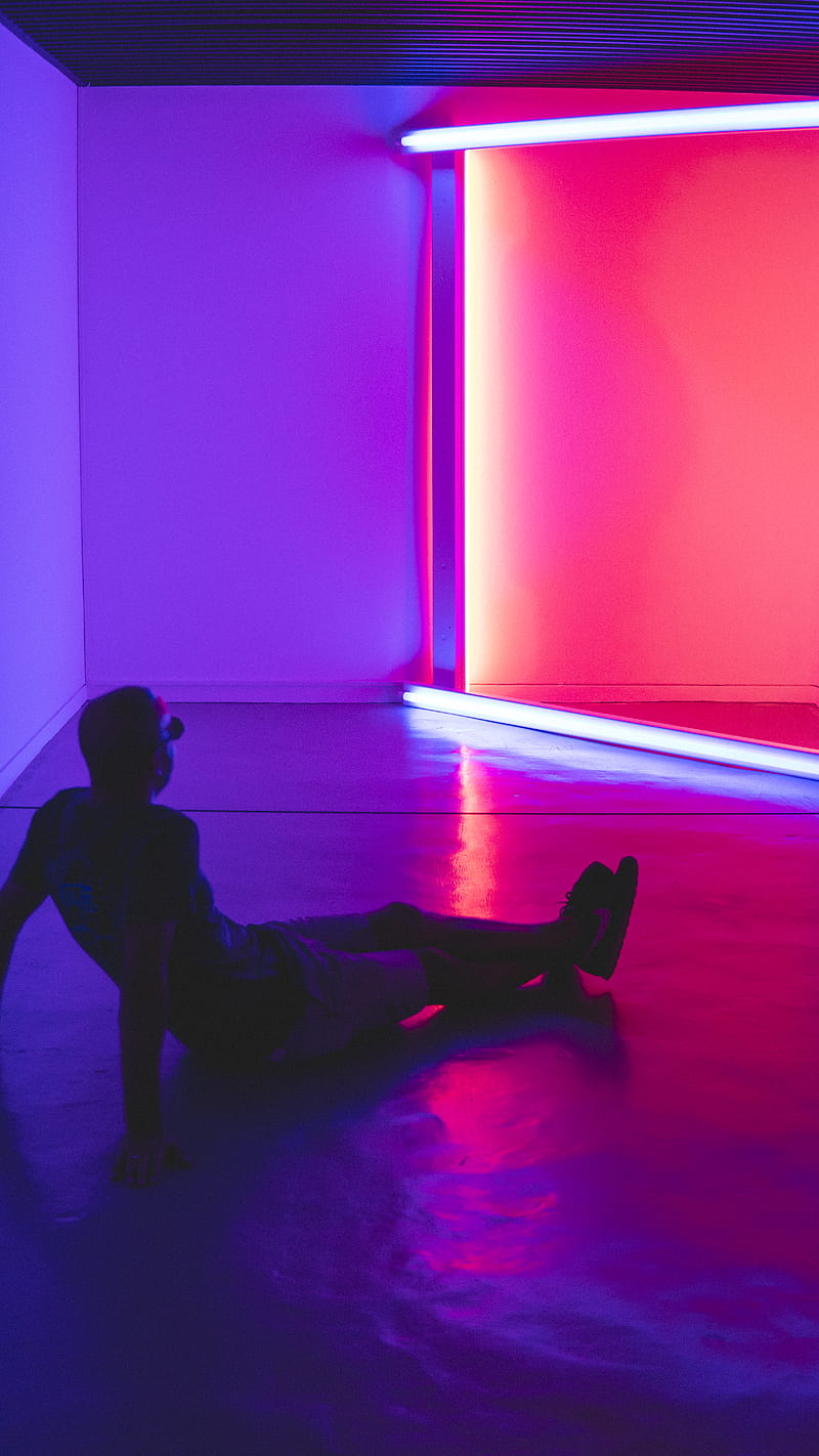 man sitting on floor facing a lighted room area, HD phone wallpaper