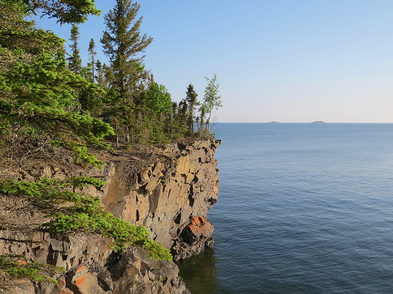 Brown rocky mountain beside blue sea under blue sky during daytime, HD ...