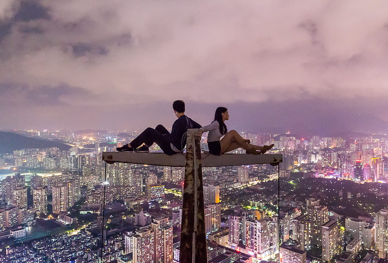 man and woman sitting on metal on top of high rise building, HD wallpaper
