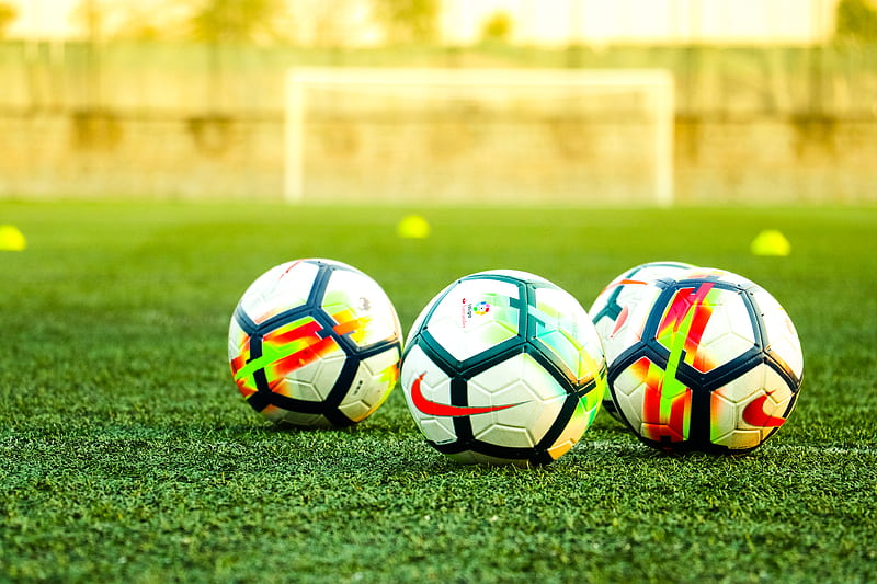 three white-and-black soccer balls on field, HD wallpaper