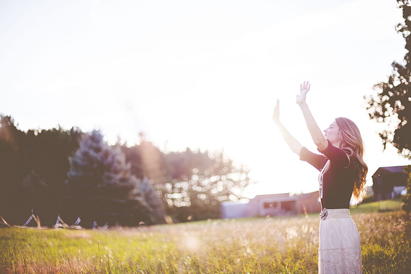 woman hands up in front of green meadows, HD wallpaper