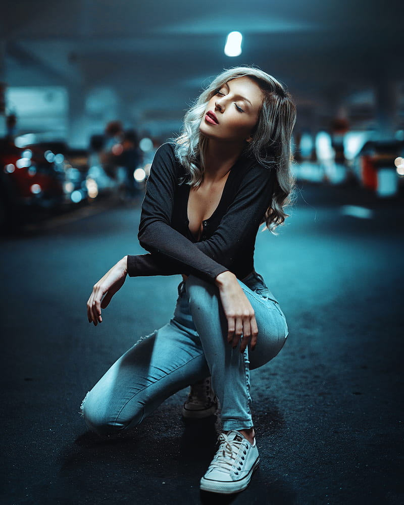 women, model, blonde, portrait display, black tops, cleavage, jeans, torn jeans, closed eyes, parted lips, arms crossed, squatting, Converse, sneakers, depth of field, parking, parking lot, car, cyan, no socks, white sneakers, HD phone wallpaper