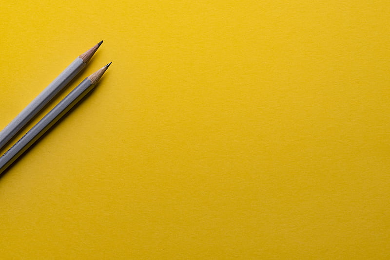 two gray pencils on yellow surface, HD wallpaper