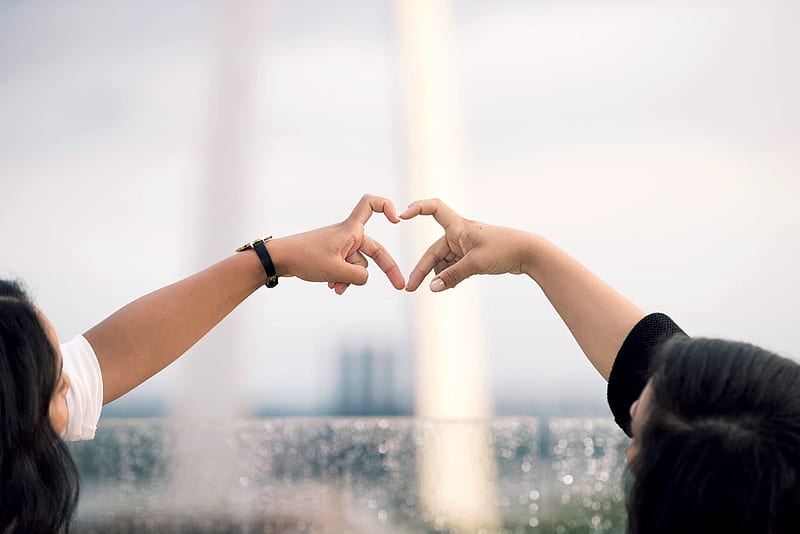 two person doing heart hand sign during daytime, HD wallpaper