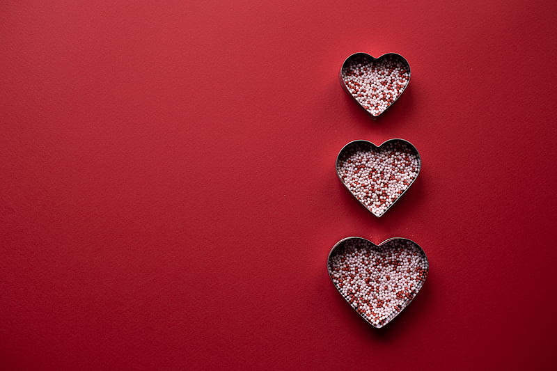 Top view of different hearts forms for cooking with sprinkling on red background, HD wallpaper