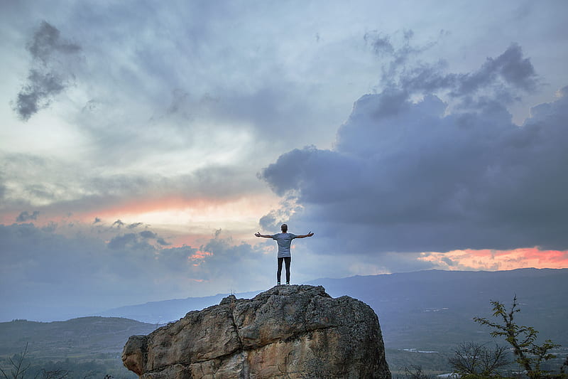 man standing on top of rock mountain during golden hour, HD wallpaper