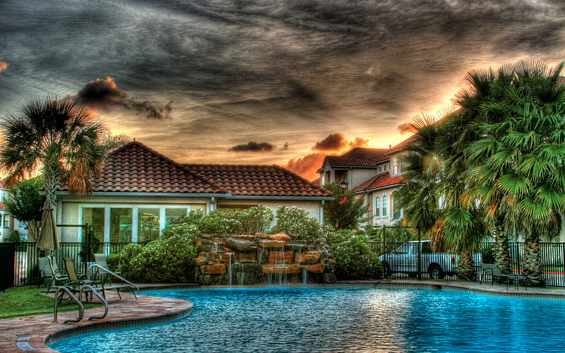 Pool, rocks, architecture, pretty, house, grass, umbrella, palm, sunset, clouds, palm trees, calm, village, beauty, chair, tropics, reflection, rest, lovely, holiday, houses, sky, trees, rooftop, water, palm tree, colorful, home, bonito, green, car, chairs, blue, exotic, view, place, richness, colors, peaceful, summer, r, nature, tropical, HD wallpaper