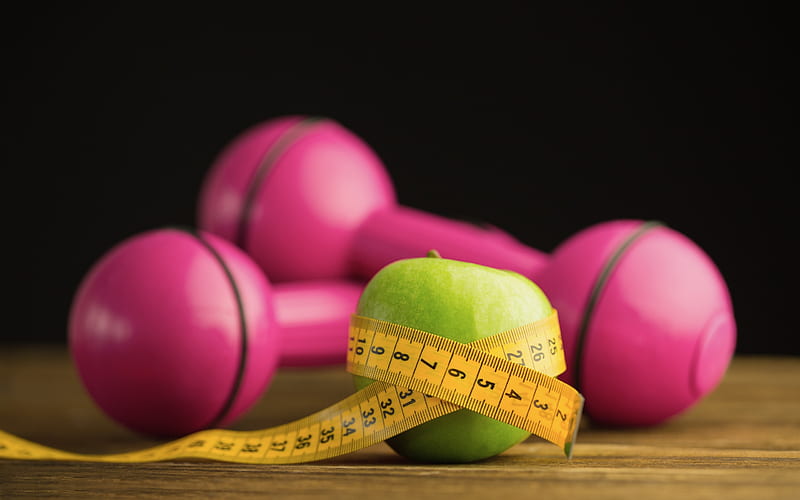Proper nutrition for lose weight. Scale, measuring tape, apple on pink  background top view space for text Stock Photo