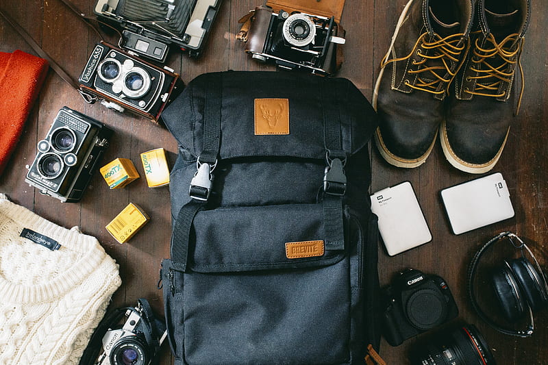 high-angle of black bag beside cameras, portable D and black leather lace-up boots, HD wallpaper