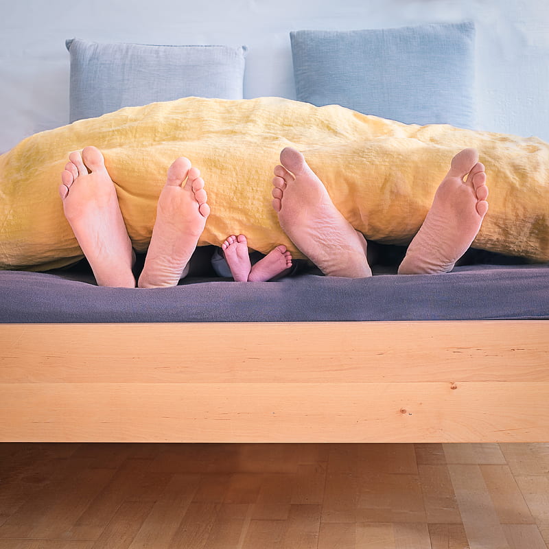 three people underneath yellow bed blanket, HD phone wallpaper