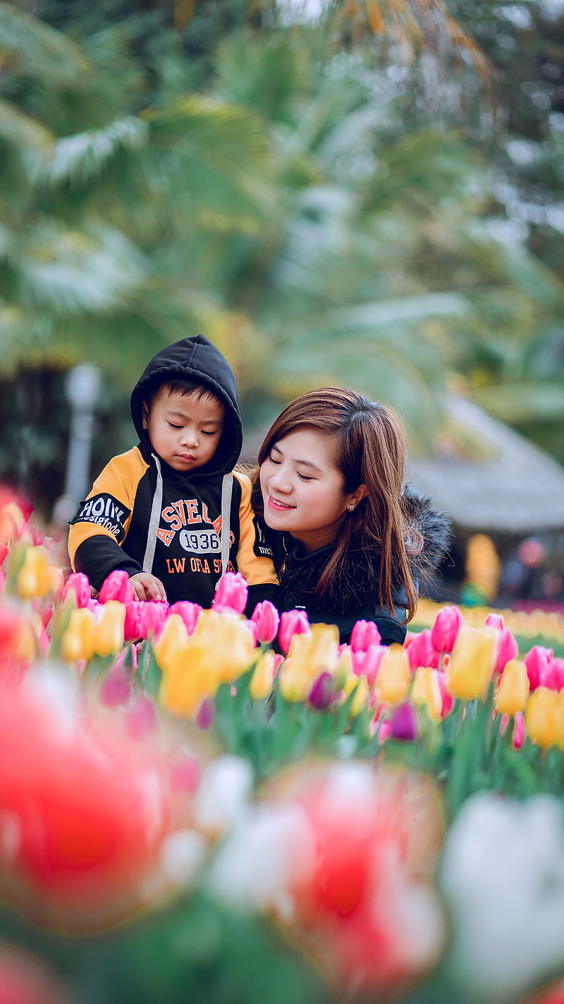 Woman and Toddler on flowers , motherhood, mom, parenting, HD phone wallpaper