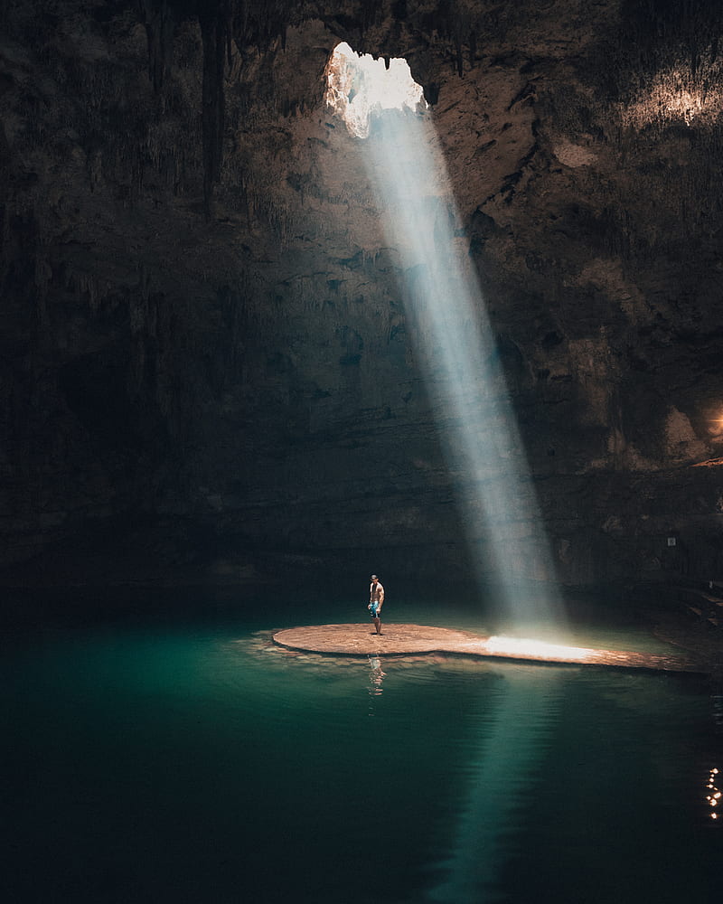 of man standing in cave surrounded by water, HD phone wallpaper