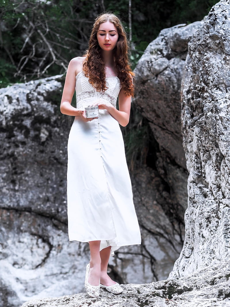 woman in white sleeveless maxi dress standing near rock, HD phone wallpaper
