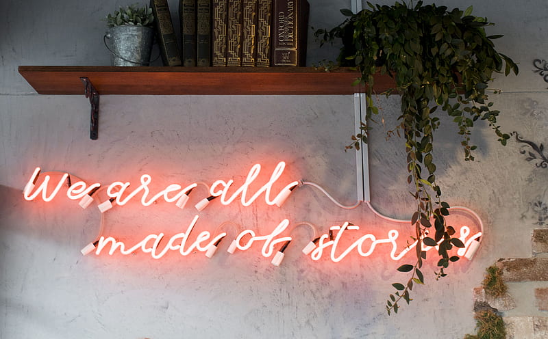 lighted we are all made of stories red neon wall signage inside room, HD wallpaper