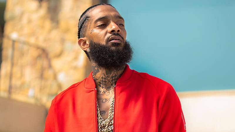 Nipsey Hussle Is Looking Side And Wearing Red Coat And Having Tattoos And Chains On Neck In A Blur Blue Background Music, HD wallpaper