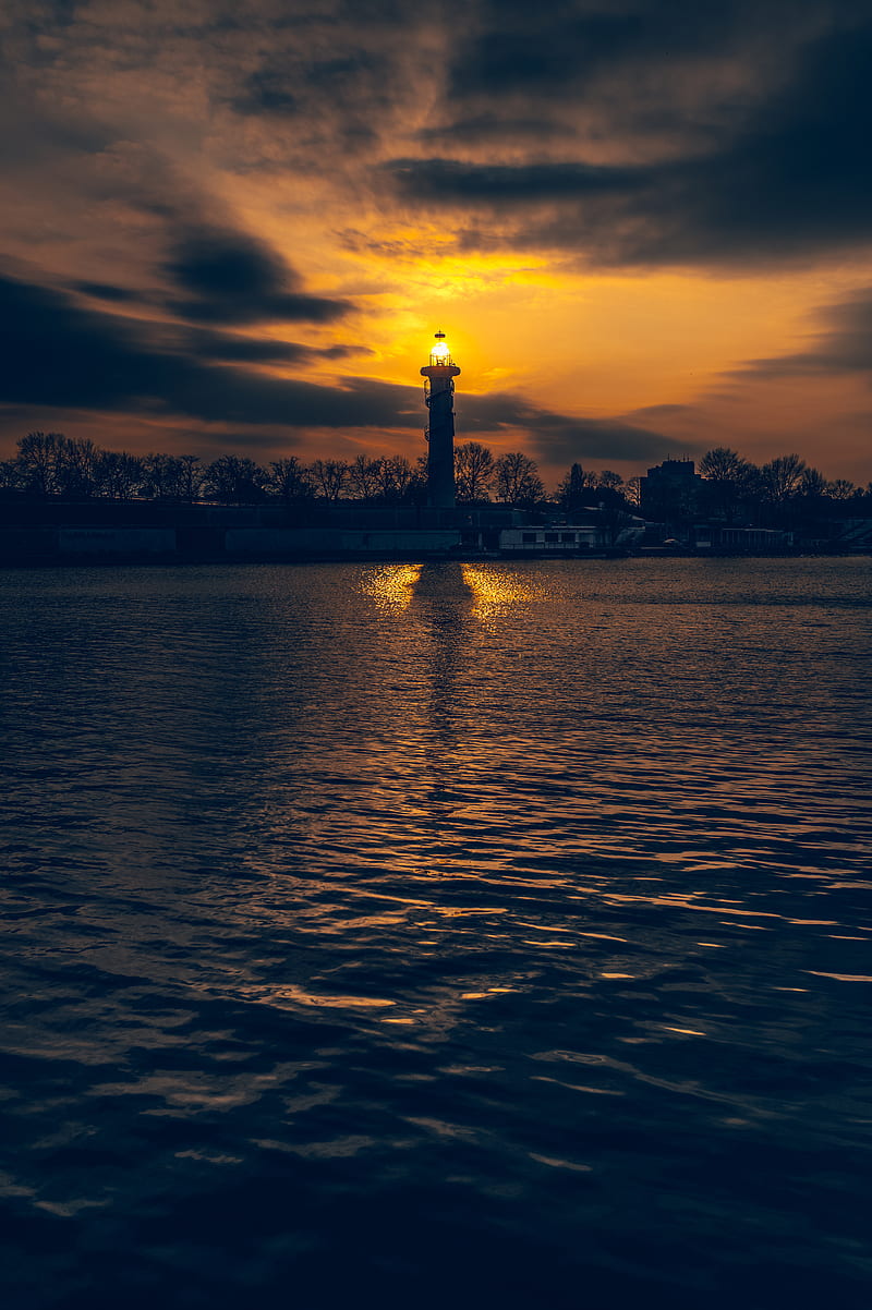 lighthouse, tower, light, water, trees, twilight, dark, HD phone wallpaper
